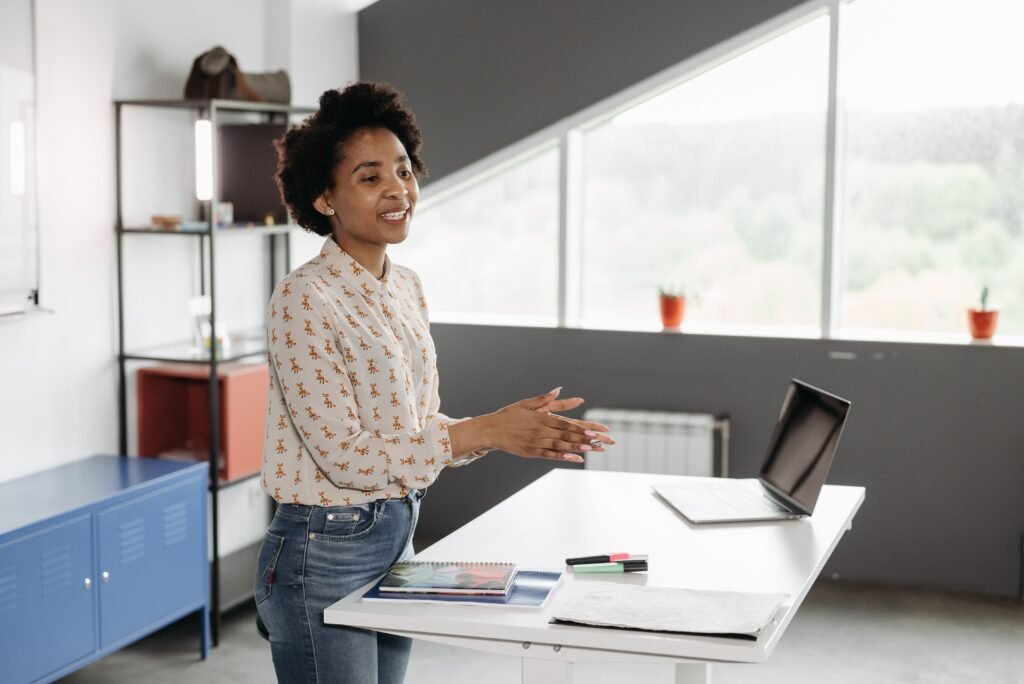 Person using a standing desk to reduce discomfort while working from home.